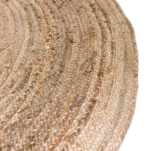 Round handwoven natural jute rug with braided spiral weave design in earthy brown and tan tones for boho rustic home décor.