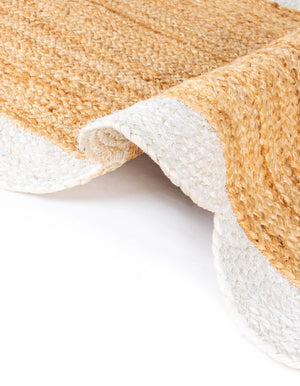 Handwoven natural jute runner rug with a white scalloped braided border