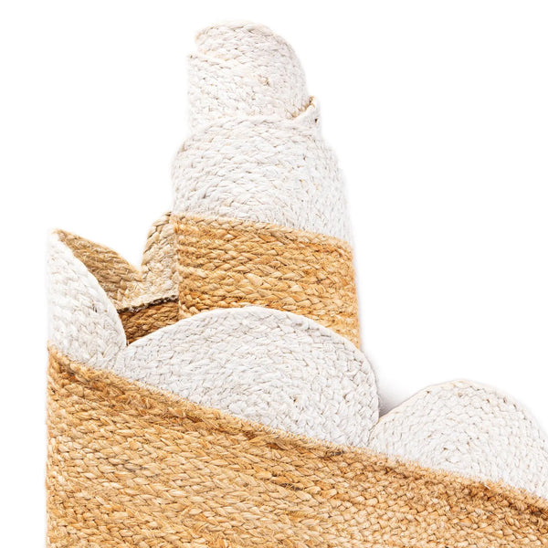 Handwoven natural jute runner rug with a white scalloped braided border