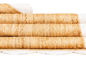 Handwoven natural jute runner rug with a white scalloped braided border