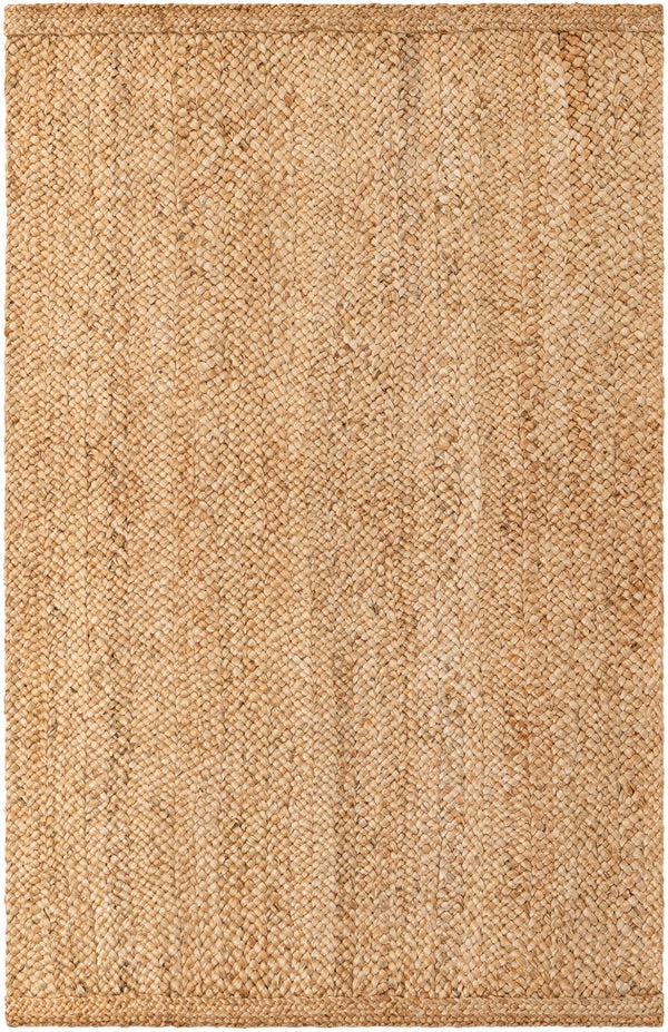 Large rectangular handwoven natural jute area rug with a thick chunky braided weave, styled under a white sofa and a rustic wooden coffee table in a warm minimalist living room.
