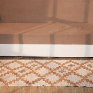 Handmade natural hemp rug with white geometric design