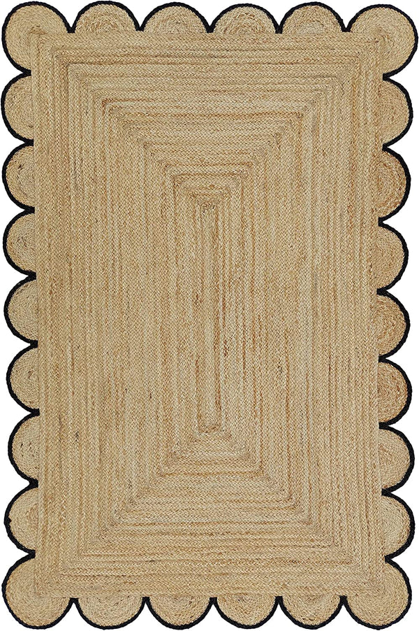 Handmade natural braided jute rug with black scalloped border displayed in a modern boho living room, eco-friendly woven area rug for living room, bedroom, farmhouse and minimalist home decor.