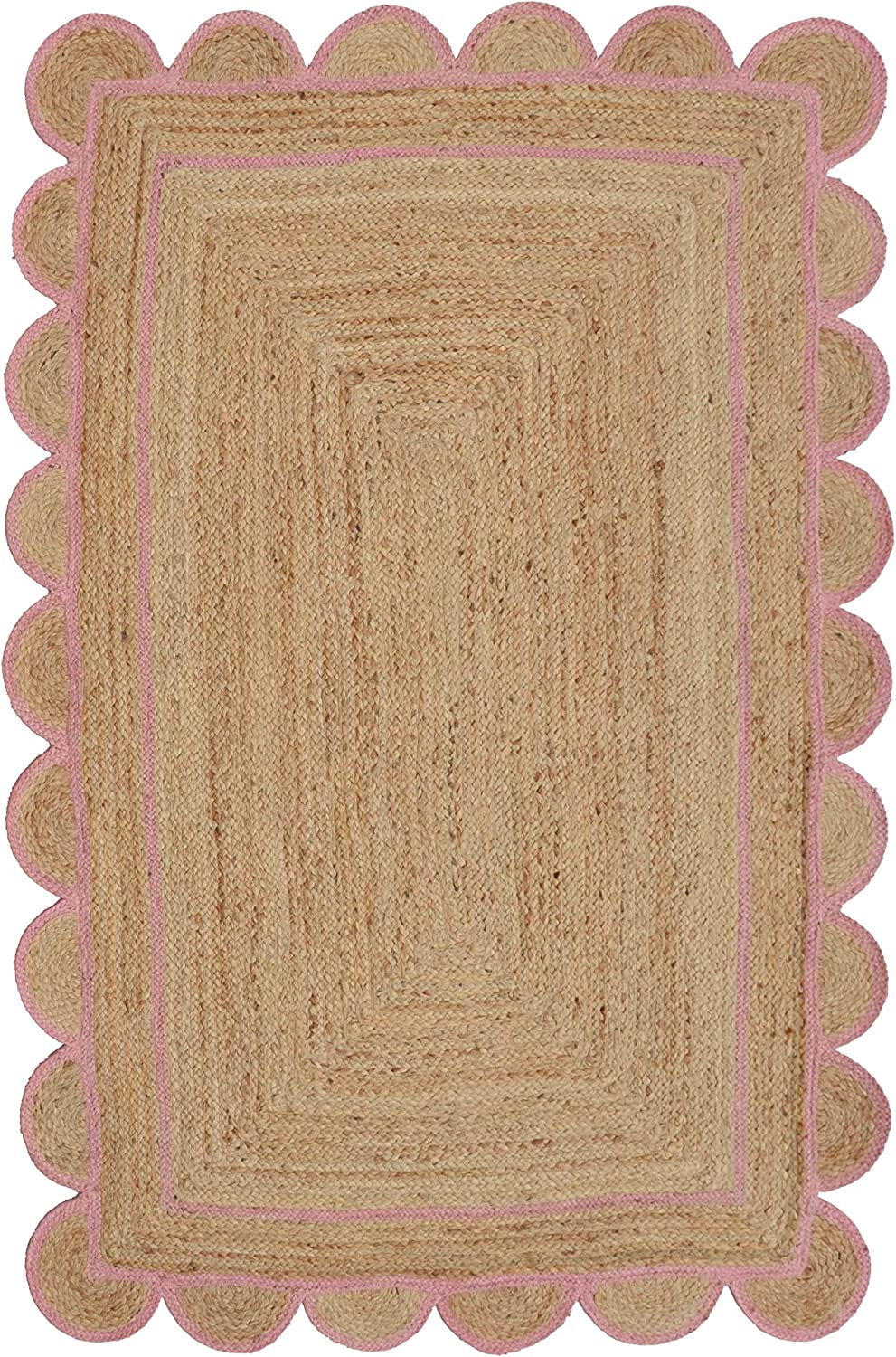 Handwoven natural jute area rug with a soft pink scalloped border styled in a modern Scandinavian living room featuring neutral furniture and natural wood flooring.