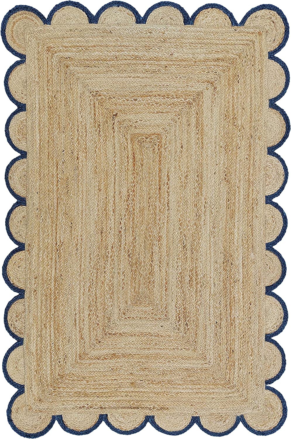 Handwoven natural jute area rug with navy blue scalloped border styled in a modern Scandinavian living room.