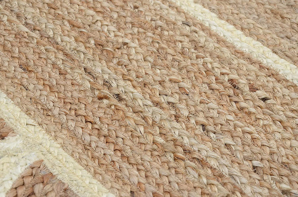 Handwoven natural jute area rug in beige and off-white with scalloped edge border for living room and bedroom