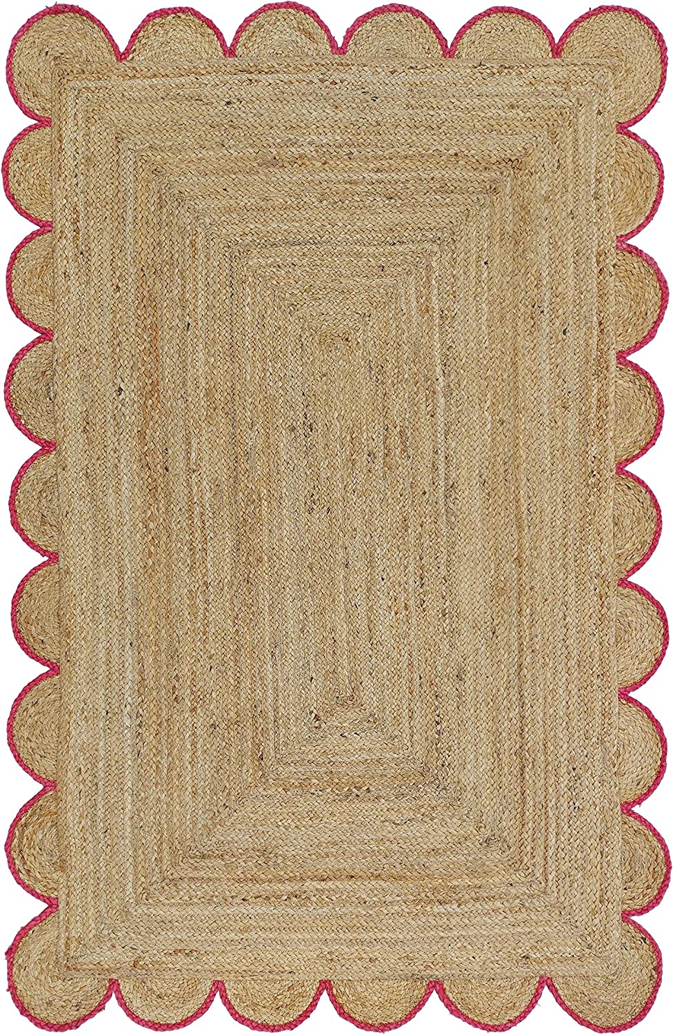Handwoven natural jute area rug with pink scalloped border in a modern Scandinavian living room.