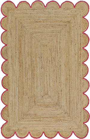 Handwoven natural jute area rug with pink scalloped border in a modern Scandinavian living room.