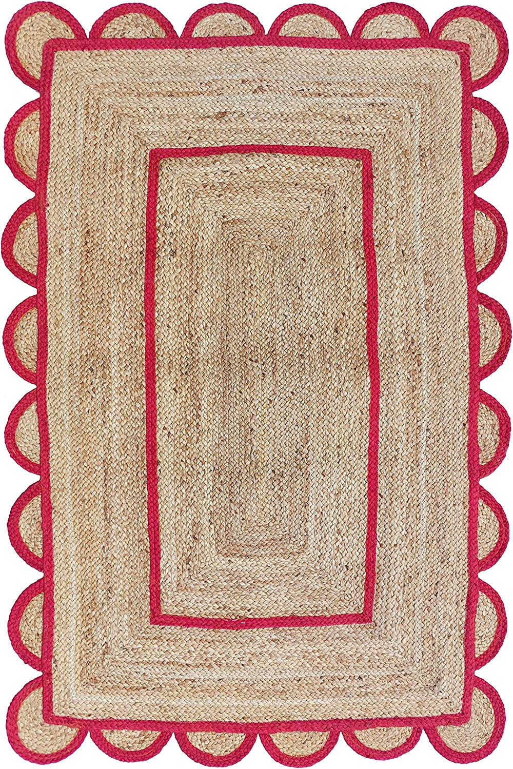 Handmade natural jute scalloped area rug with vibrant pink border in a modern boho living room