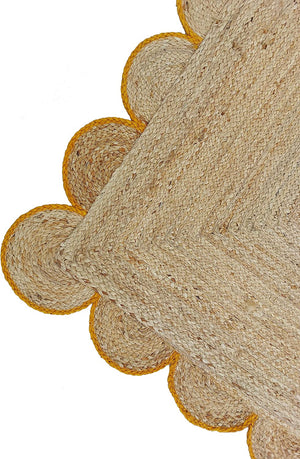 Handwoven Natural Jute Area Rug with Mustard Scalloped Border Styled in a Modern Scandinavian Living Room