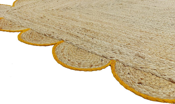 Handwoven Natural Jute Area Rug with Mustard Scalloped Border Styled in a Modern Scandinavian Living Room