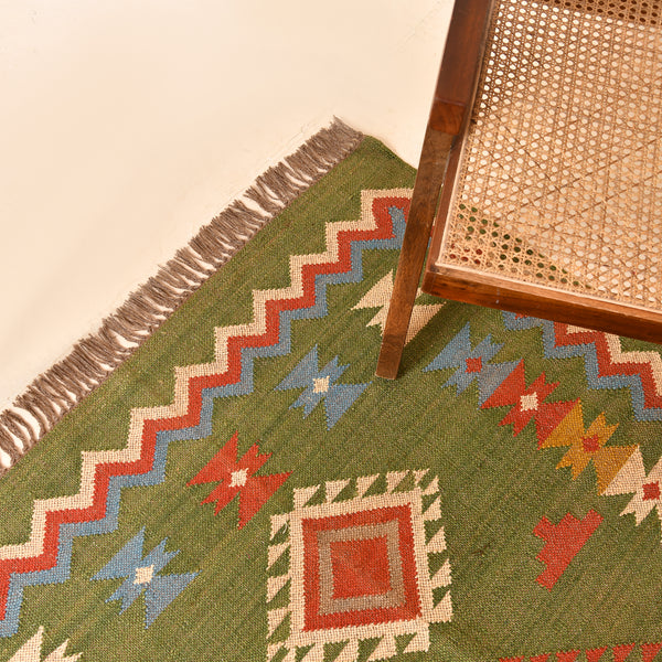 Handwoven green Kilim area rug with colorful tribal geometric pattern, handmade wool cotton flatweave boho rug for living room and bedroom.