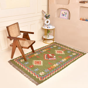 Handwoven green Kilim area rug with colorful tribal geometric pattern, handmade wool cotton flatweave boho rug for living room and bedroom.