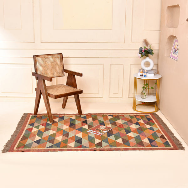 Handwoven multicolor geometric kilim area rug featuring colorful triangle patterns in wool and natural jute for living room, bedroom, hallway, and modern home décor.
