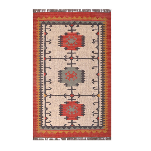 Handwoven ivory wool Kilim area rug featuring tribal geometric medallions and traditional border design, styled in a modern living room.