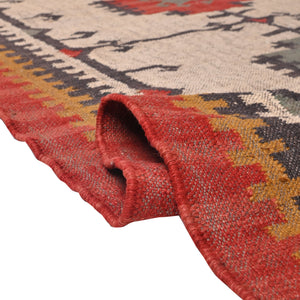 Handwoven ivory wool Kilim area rug featuring tribal geometric medallions and traditional border design, styled in a modern living room.