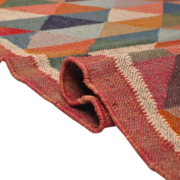 Handwoven multicolor geometric kilim area rug featuring colorful triangle patterns in wool and natural jute for living room, bedroom, hallway, and modern home décor.
