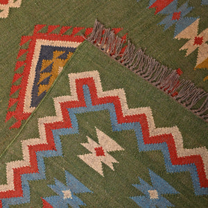 Handwoven green Kilim area rug with colorful tribal geometric pattern, handmade wool cotton flatweave boho rug for living room and bedroom.