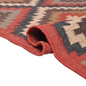 Handwoven geometric wool jute kilim area rug with tribal diamond pattern in terracotta, beige, charcoal, and ivory colors for living room and bedroom décor.