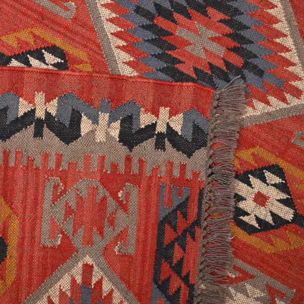 Handwoven terracotta geometric wool Kilim area rug with tribal diamond patterns and fringe, perfect for boho, farmhouse, rustic, and Southwestern home décor.