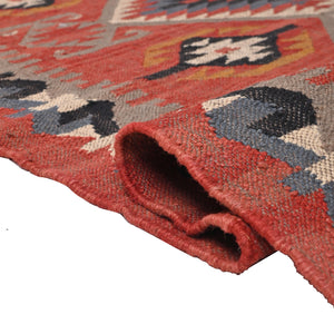 Handwoven terracotta geometric wool Kilim area rug with tribal diamond patterns and fringe, perfect for boho, farmhouse, rustic, and Southwestern home décor.