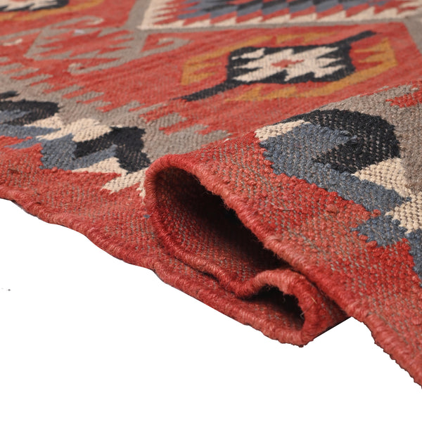 Handwoven terracotta geometric wool Kilim area rug with tribal diamond patterns and fringe, perfect for boho, farmhouse, rustic, and Southwestern home décor.