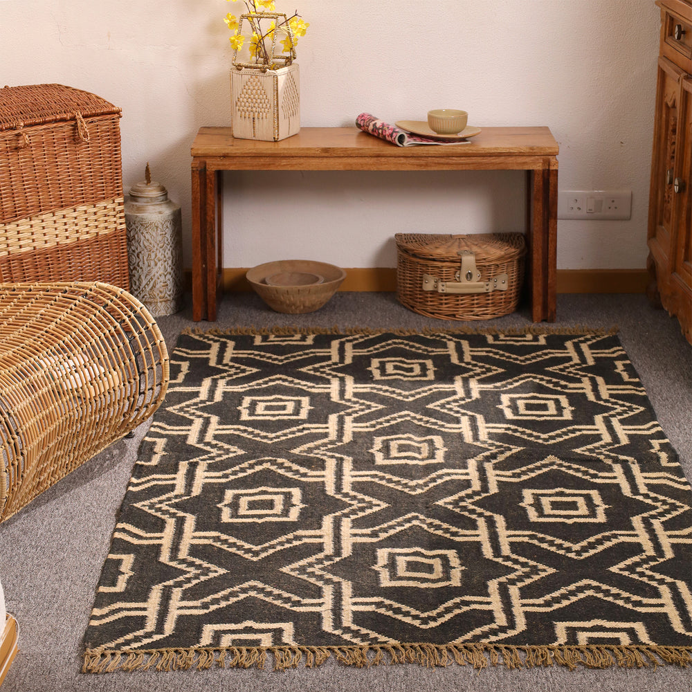 Handwoven black and ivory geometric wool Kilim area rug with tribal diamond pattern for modern boho living room décor.