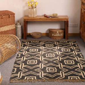 Handwoven black and ivory geometric wool Kilim area rug with tribal diamond pattern for modern boho living room décor.