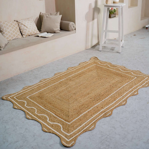 Handwoven beige hemp rug with scalloped wavy border