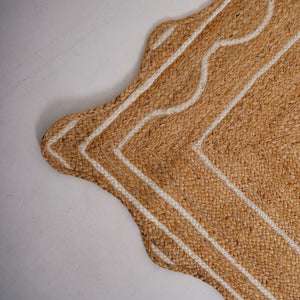 Scalloped edge natural hemp area rug with white border