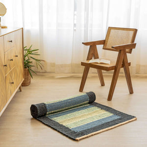 Handwoven striped hemp area rug in blue green and natural tones