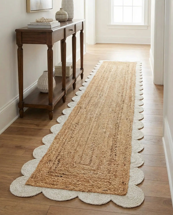 Handwoven natural jute runner rug with a white scalloped braided border